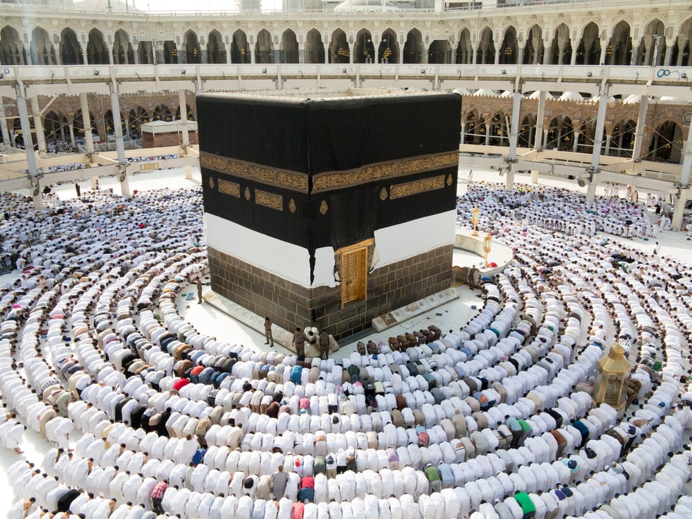 Kaaba the Holy mosque in Mecca with Muslim people pilgrims of Hajj praying in crowd (newest and very rare images of Holiest mosque after latest widening 2013-3014)