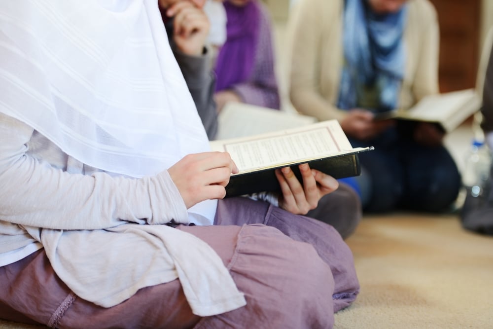 Muslim and Arabic girls reading Koran together in group-2